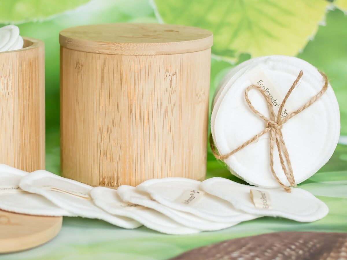 reusable cotton pads and beige bamboo jar with lid