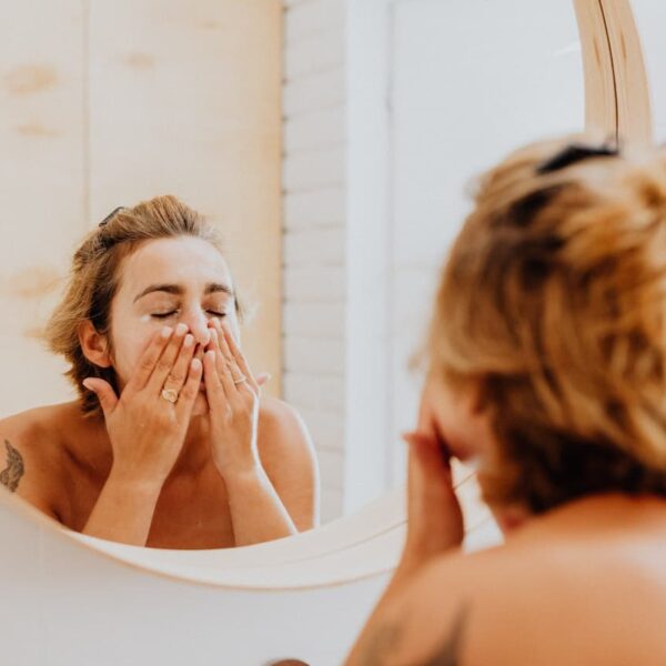 Woman Washing Face With Cream Cleanser